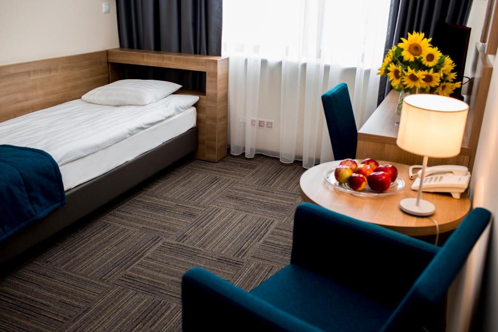 Posteľ alebo postele v izbe v ubytovaní Hotel Meeting