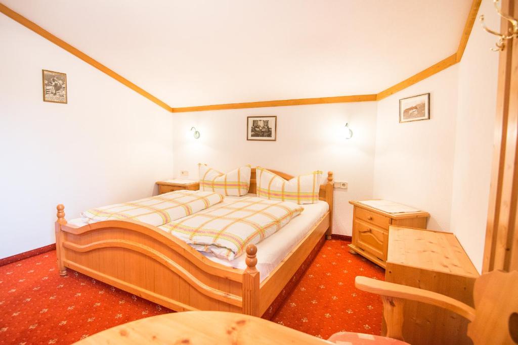 Postel nebo postele na pokoji v ubytování Haus Gleinser - Neustift im Stubaital