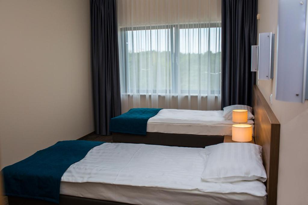 Posteľ alebo postele v izbe v ubytovaní Hotel Meeting