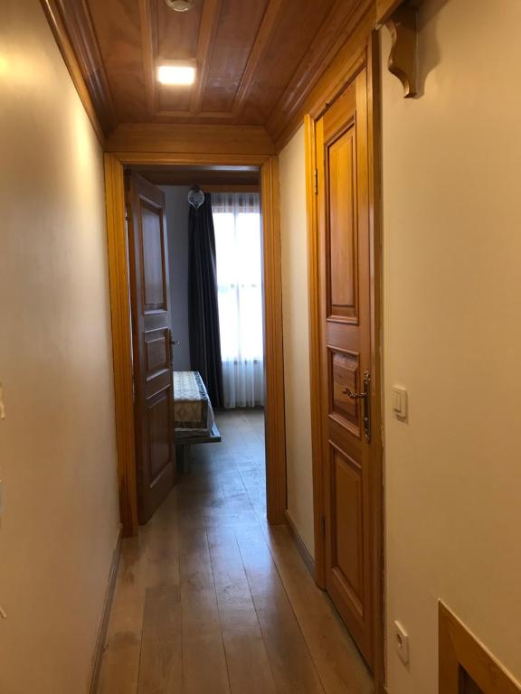 A bed or beds in a room at Green Mansion