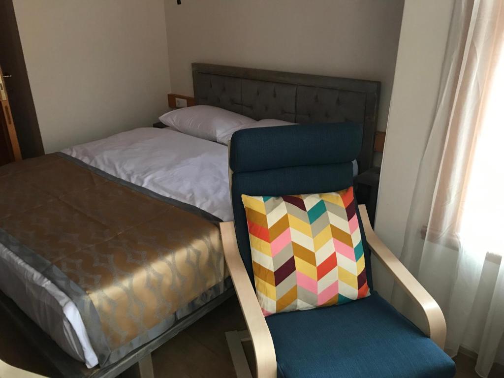 A bed or beds in a room at Green Mansion