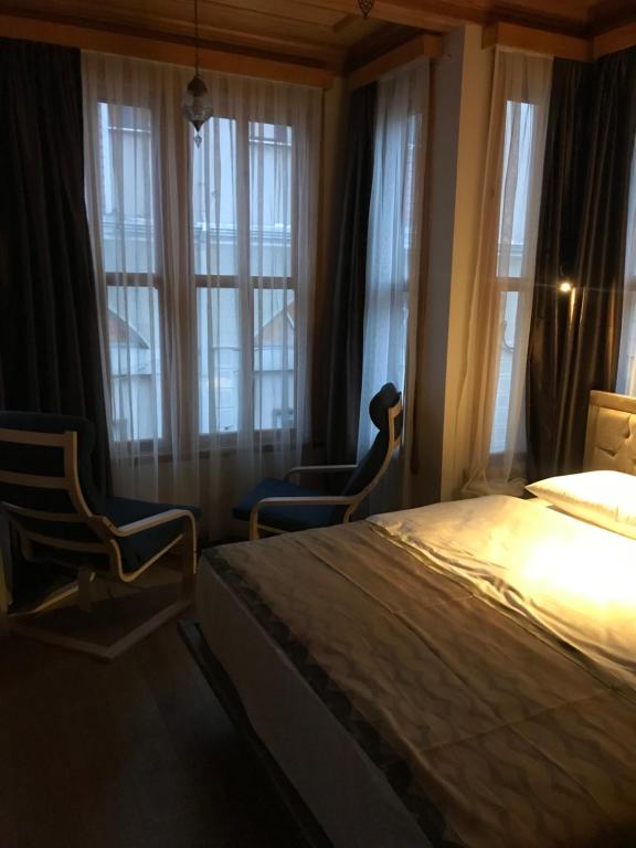 A bed or beds in a room at Green Mansion