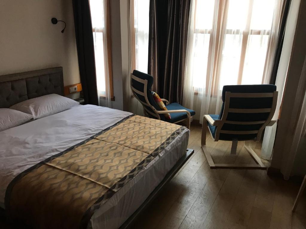 A bed or beds in a room at Green Mansion