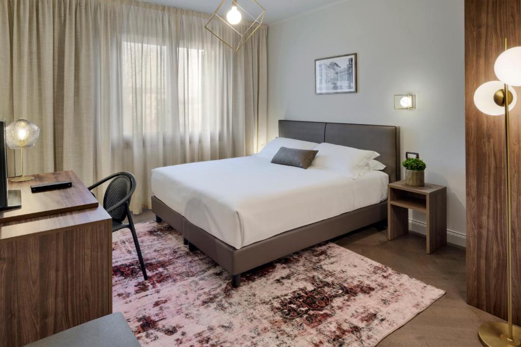Postel nebo postele na pokoji v ubytování Porta Altinia Suites
