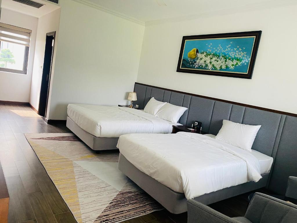 Postel nebo postele na pokoji v ubytování Glory Resort