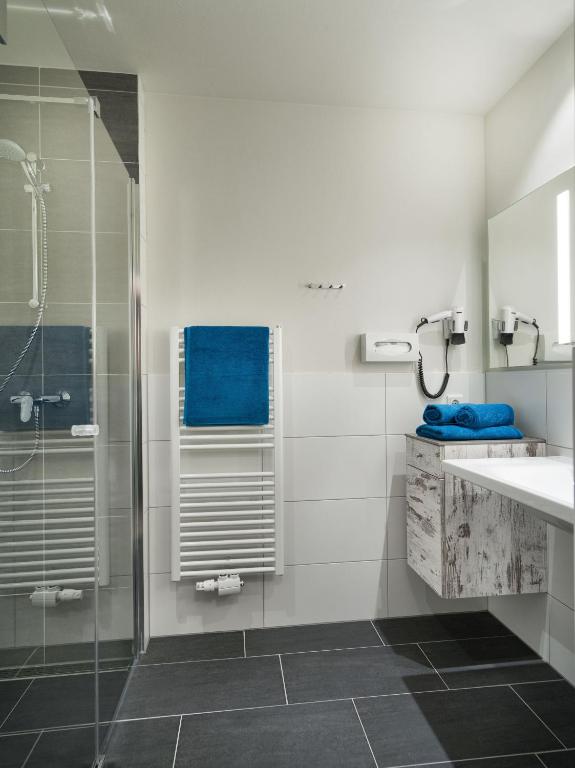 Koupelna v ubytování Hotel Sportwelt