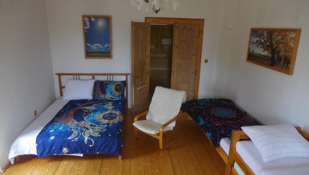 Postel nebo postele na pokoji v ubytování Statek Polánka