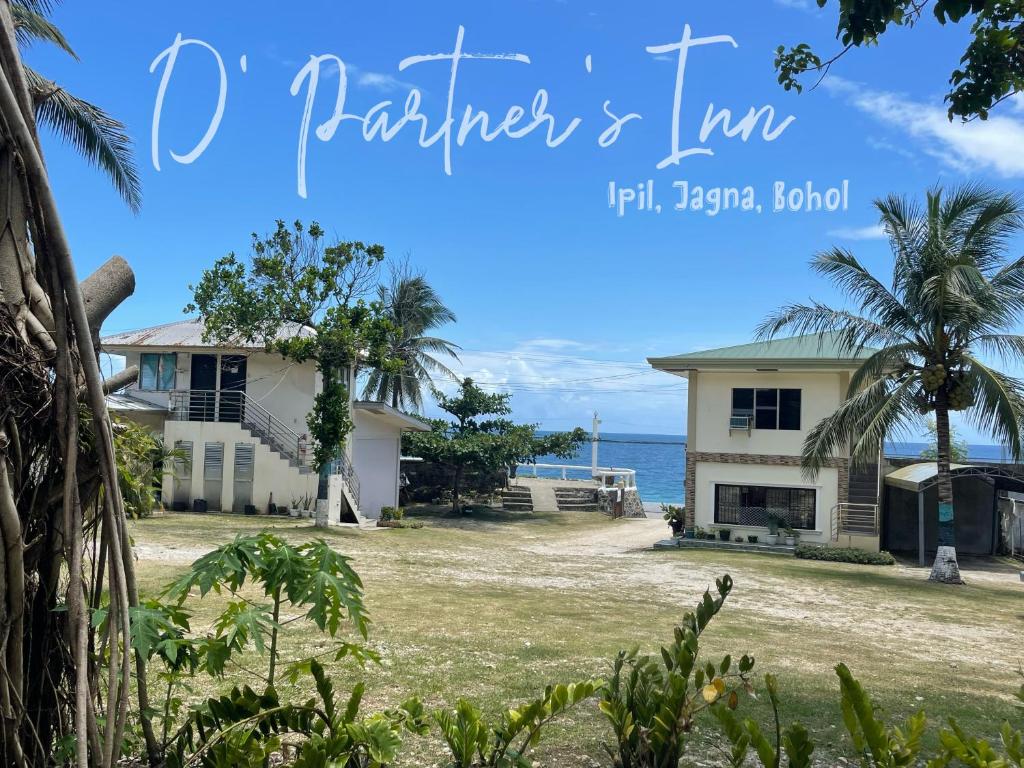 a house on the beach with the ocean in the background at D' Partner's Inn in Jagna