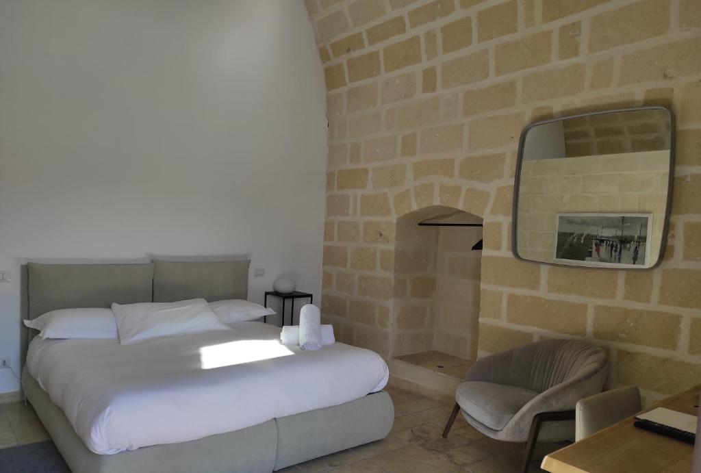 Łóżko lub łóżka w pokoju w obiekcie Residence Masseria Santa Lucia