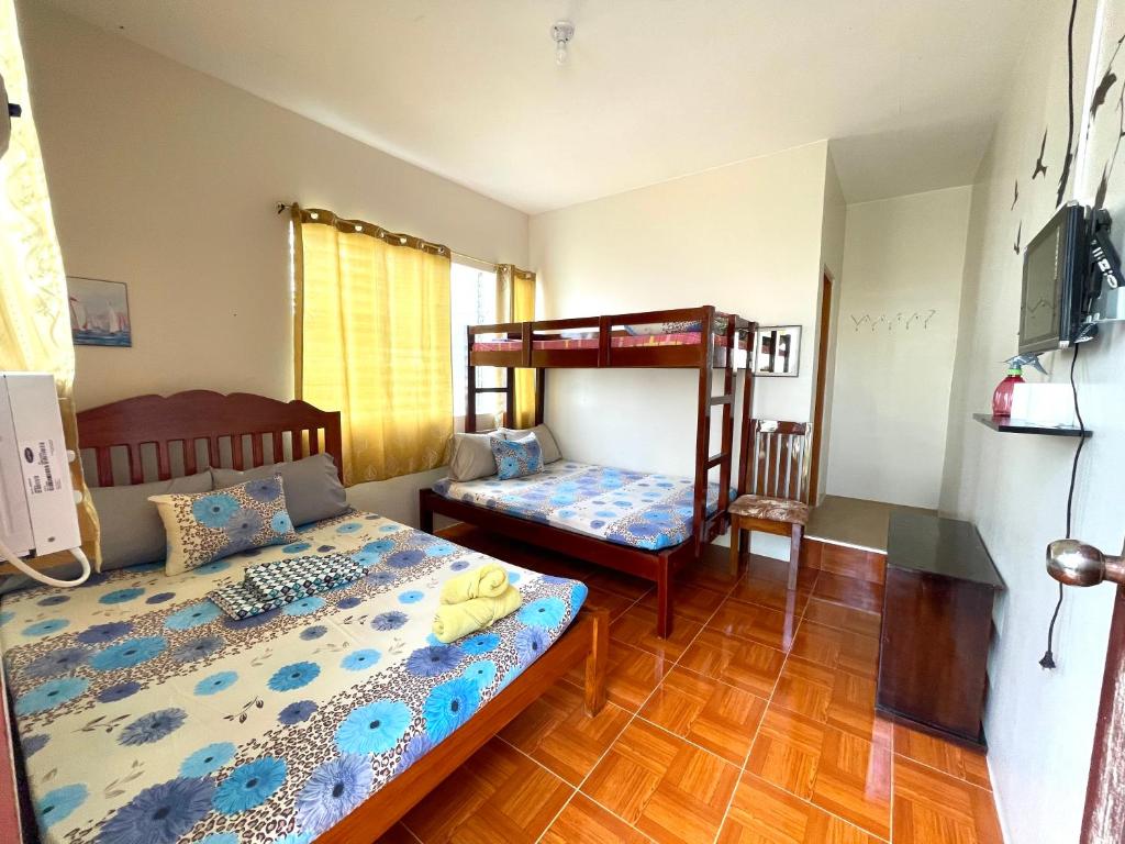 Postel nebo postele na pokoji v ubytování D' Partner's Inn