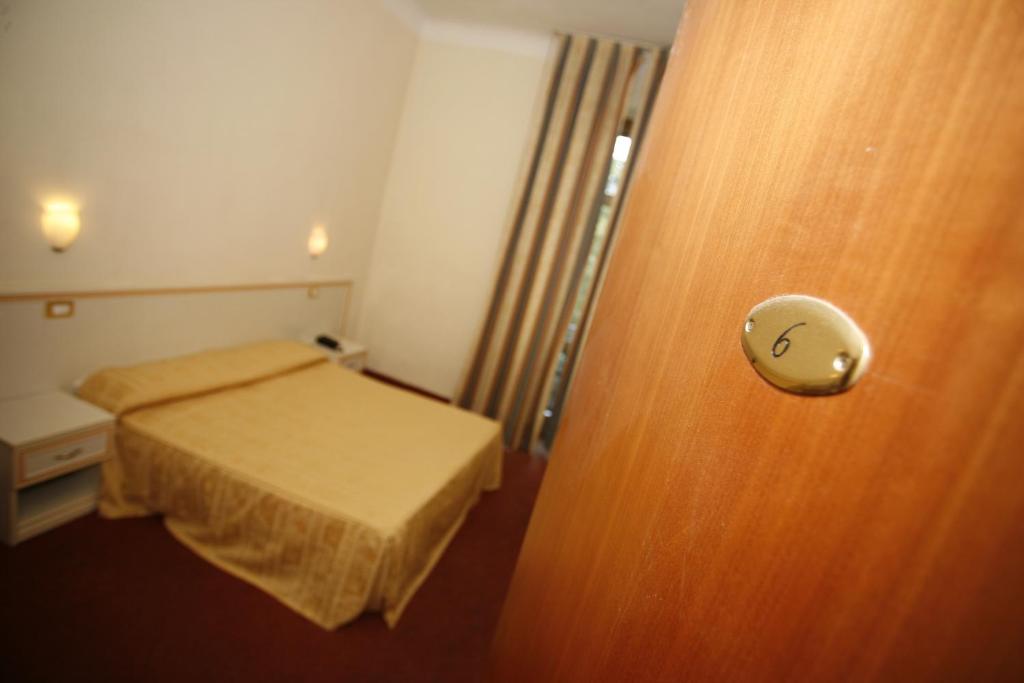 Postel nebo postele na pokoji v ubytování Hotel Adler
