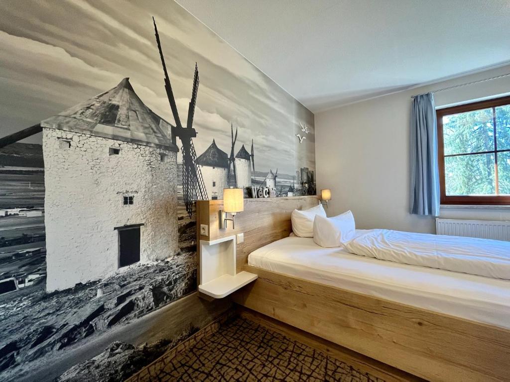 Postel nebo postele na pokoji v ubytování Hotel in der Mühle