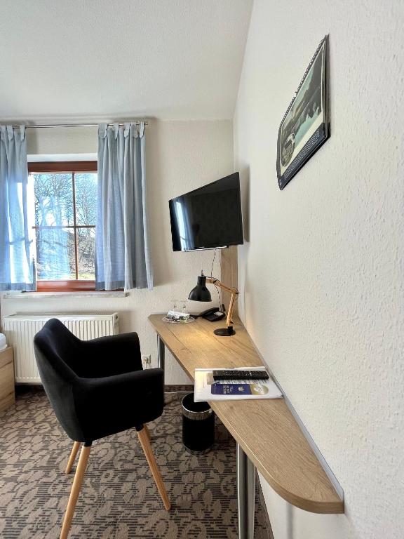 TV a/nebo společenská místnost v ubytování Hotel in der Mühle