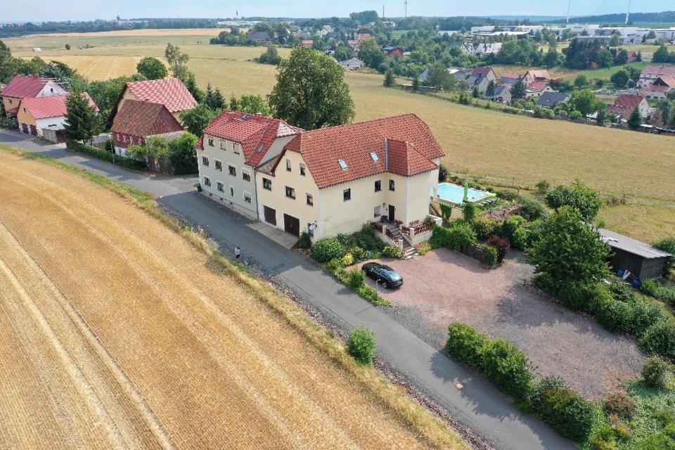 an aerial view of a large house with a driveway at Pension Riegler in Nossen
