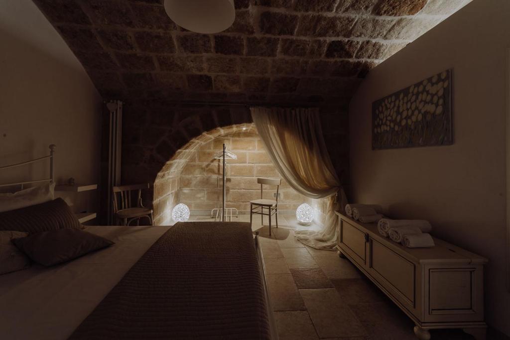 A bed or beds in a room at Casa Vacanza Portanuova Monopoli by MONHOLIDAY