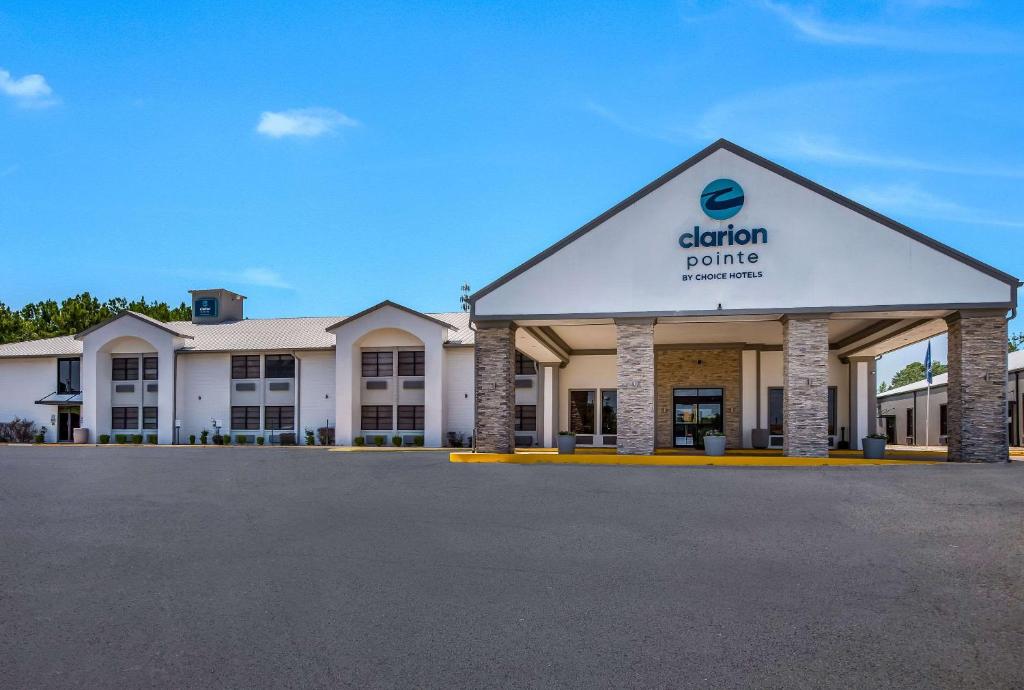 a building with a sign on the front of it at Clarion Pointe Marshall in Marshall