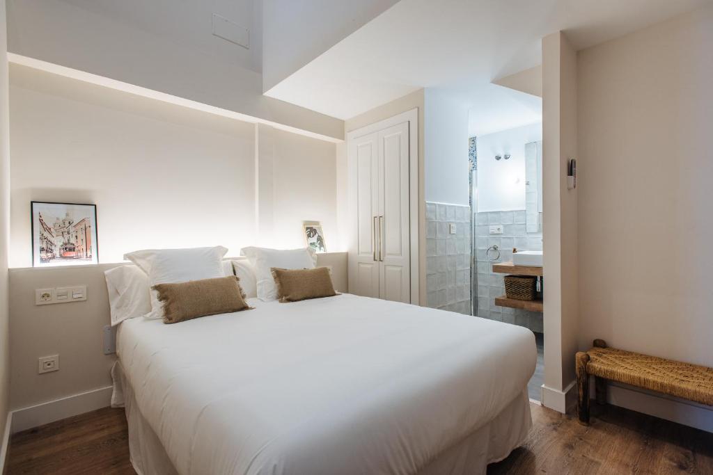 Posteľ alebo postele v izbe v ubytovaní La Sillería de Triana by Magno Apartments