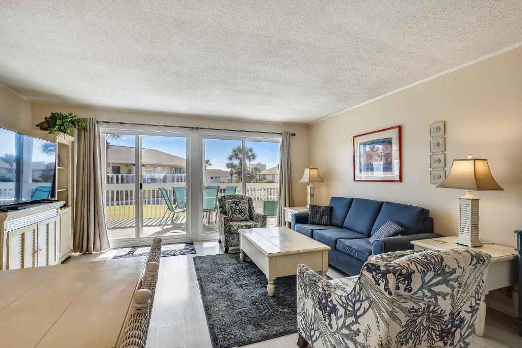 a living room with a couch and a table at Sandpiper Cove 1082 Destin Condo in Destin