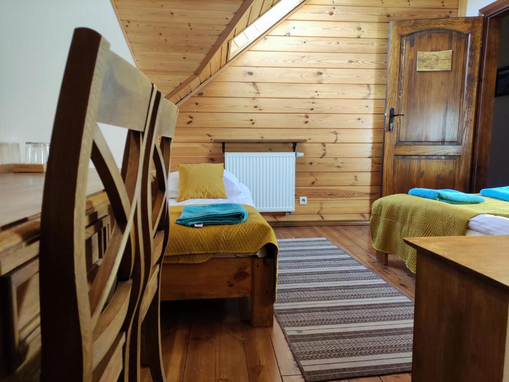 Postel nebo postele na pokoji v ubytování Dolina Biebrzy - Ośrodek Agroturystyczny