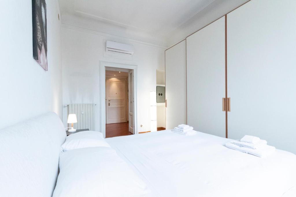 Posteľ alebo postele v izbe v ubytovaní Washington Apartment