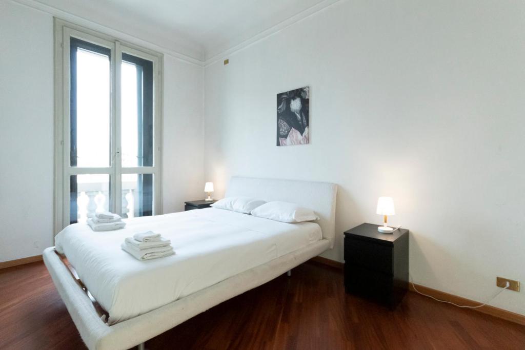 Posteľ alebo postele v izbe v ubytovaní Washington Apartment