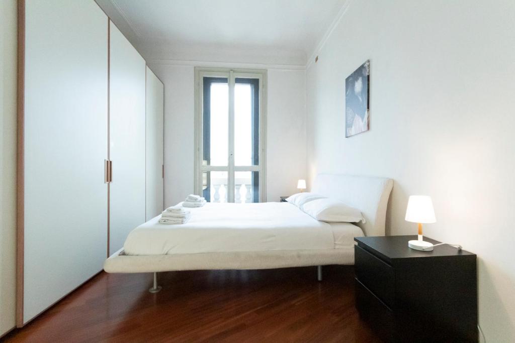 Posteľ alebo postele v izbe v ubytovaní Washington Apartment