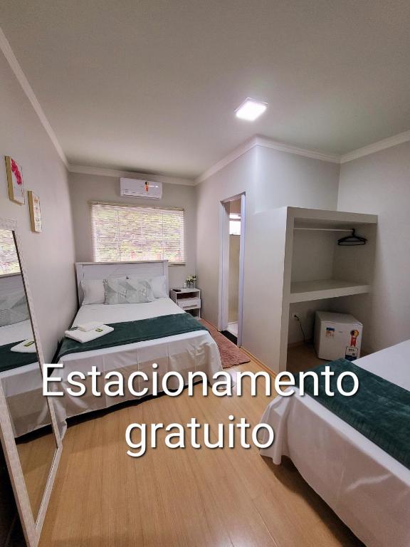 Postel nebo postele na pokoji v ubytování Hotel Hiperion Maringá