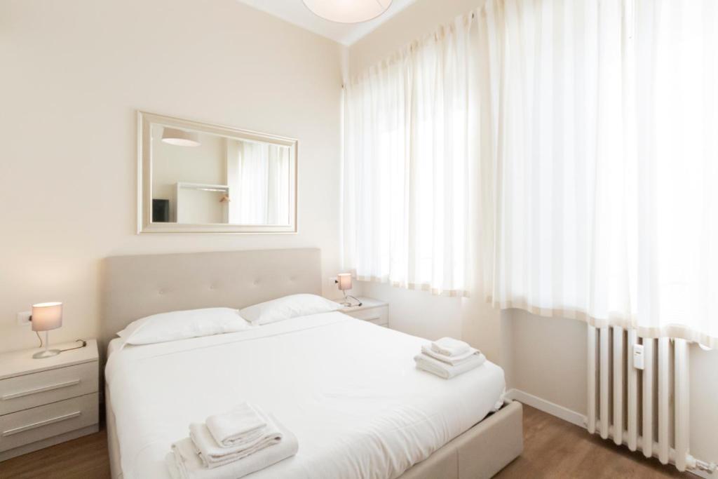 Łóżko lub łóżka w pokoju w obiekcie Via Torino Apartment 3
