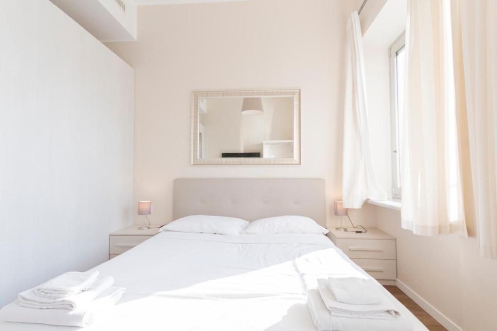 Łóżko lub łóżka w pokoju w obiekcie Via Torino Apartment 3