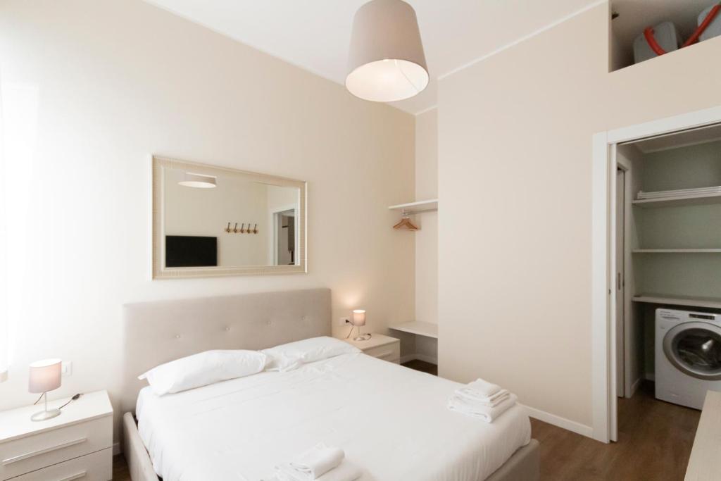 Łóżko lub łóżka w pokoju w obiekcie Via Torino Apartment 3