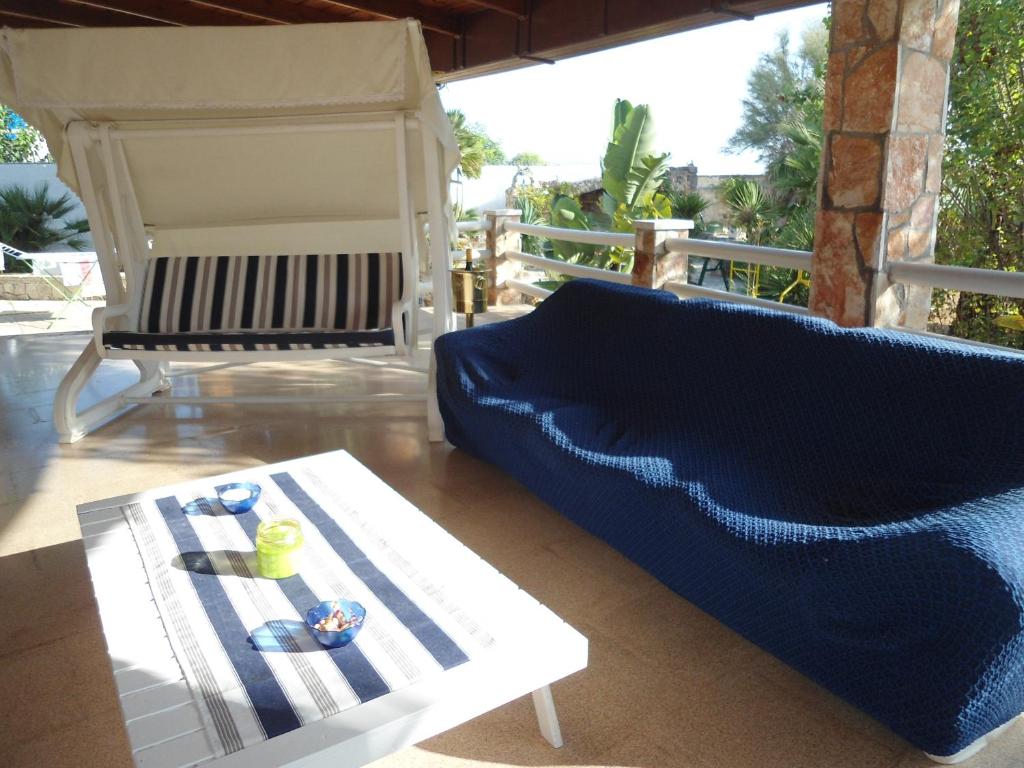 a living room with a couch and a table at Ville Alba & Azzurra in Polignano a Mare