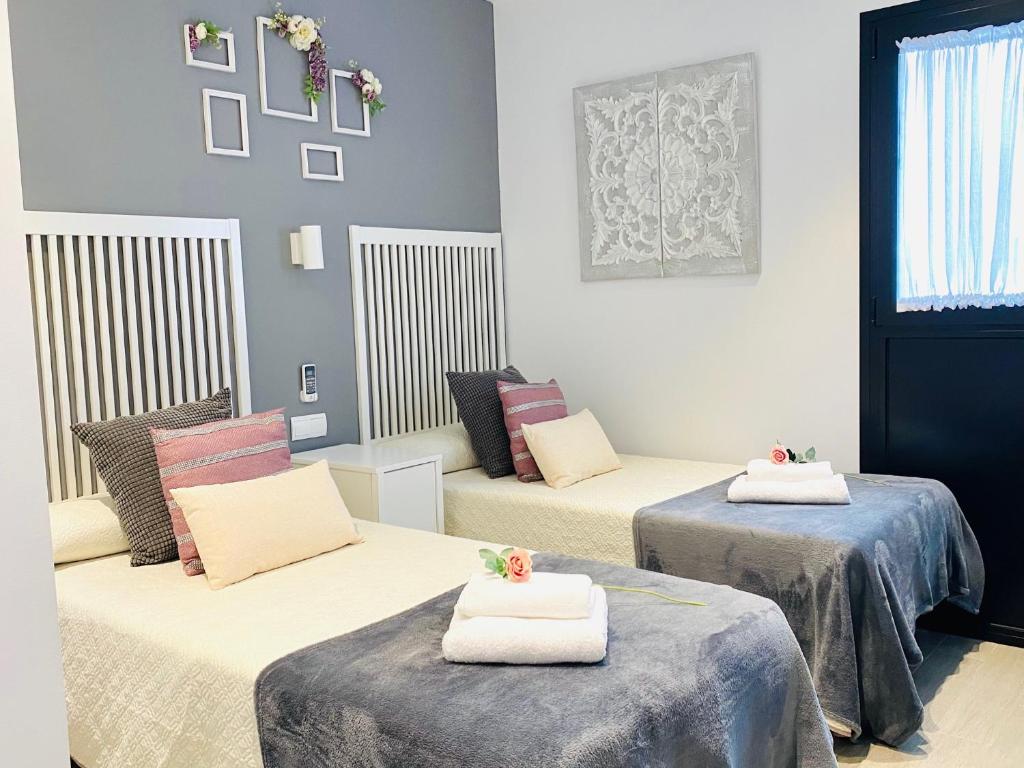 Posteľ alebo postele v izbe v ubytovaní Hostal Alisol Boutique San Pedro