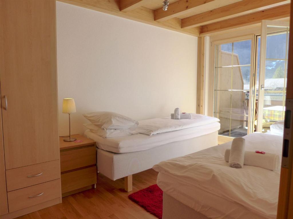 Postel nebo postele na pokoji v ubytování Apartment Staubbach by Interhome