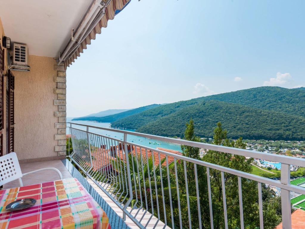 a balcony with a view of the ocean at Apartment Adria - RAC171 by Interhome in Rabac