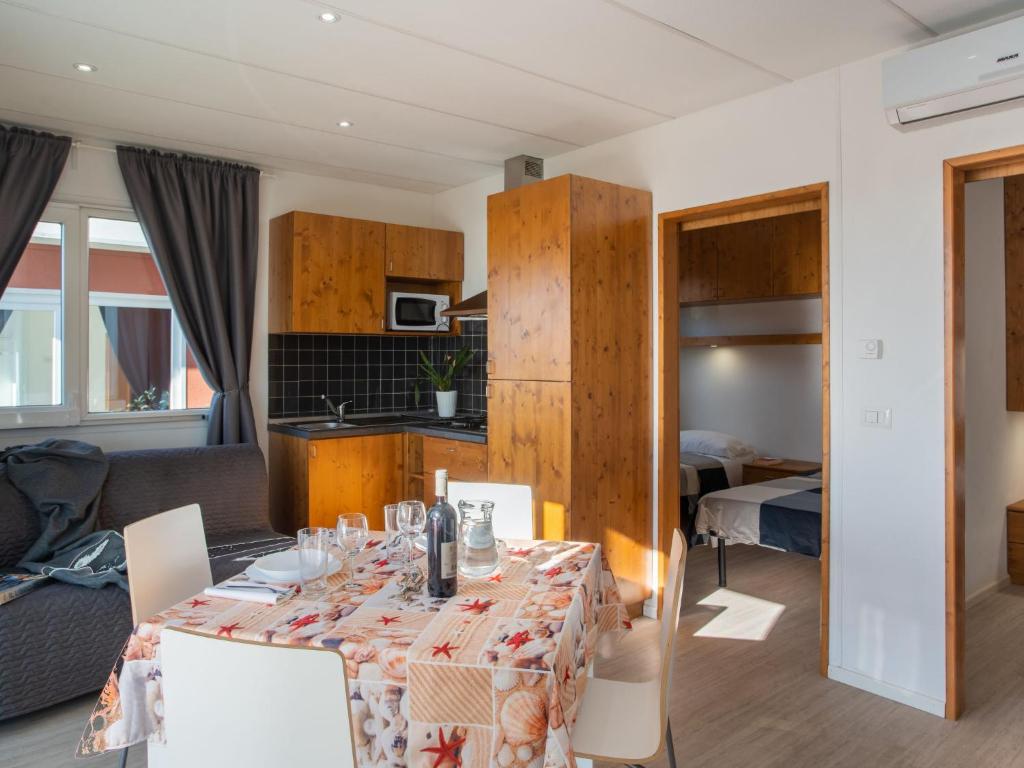 A kitchen or kitchenette at Holiday Home Mandorlo - SLR401 by Interhome