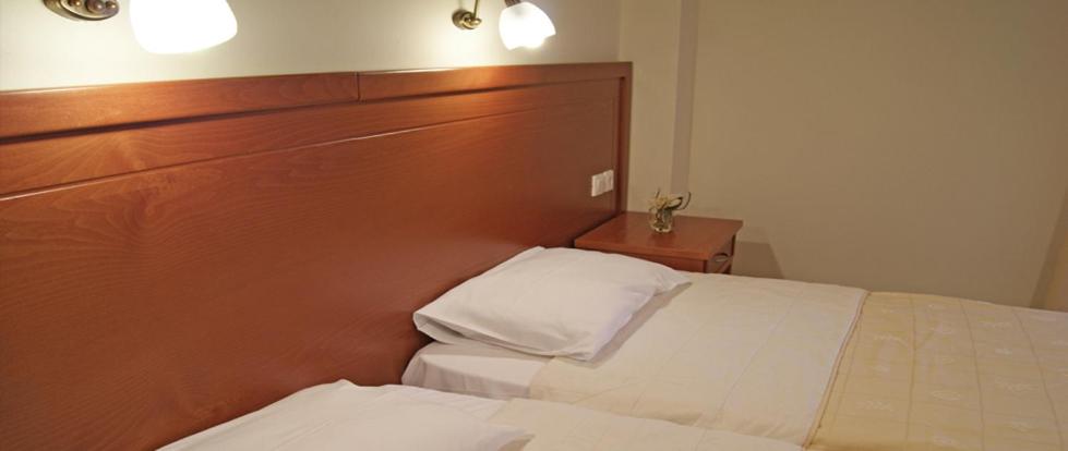 A bed or beds in a room at Neon Studios
