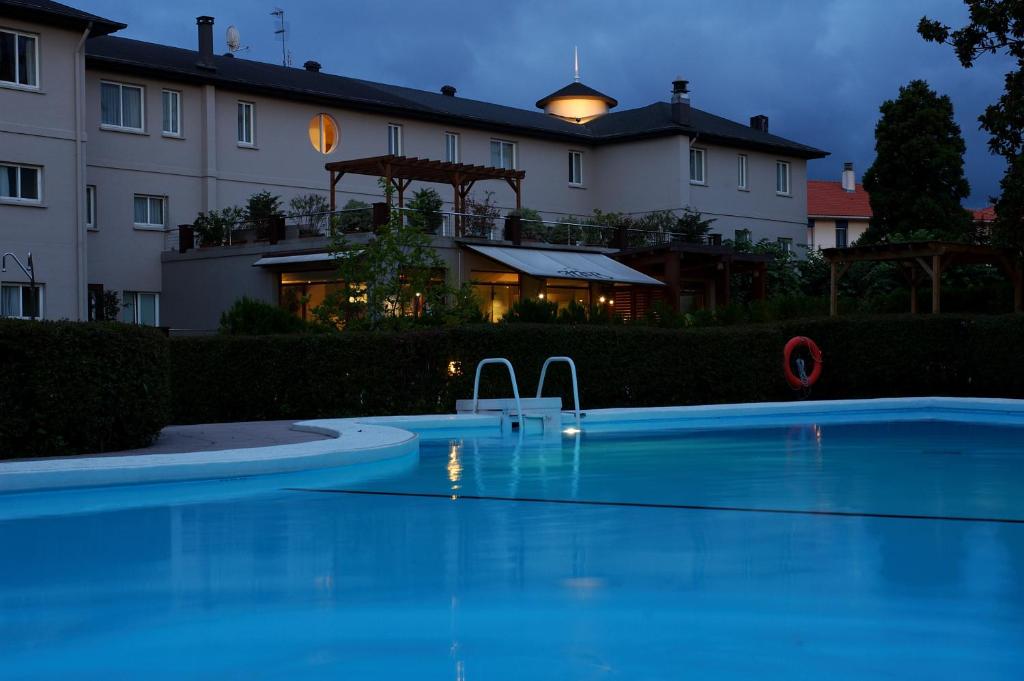 a large swimming pool in front of a building at Hotel Rio Bidasoa in Hondarribia