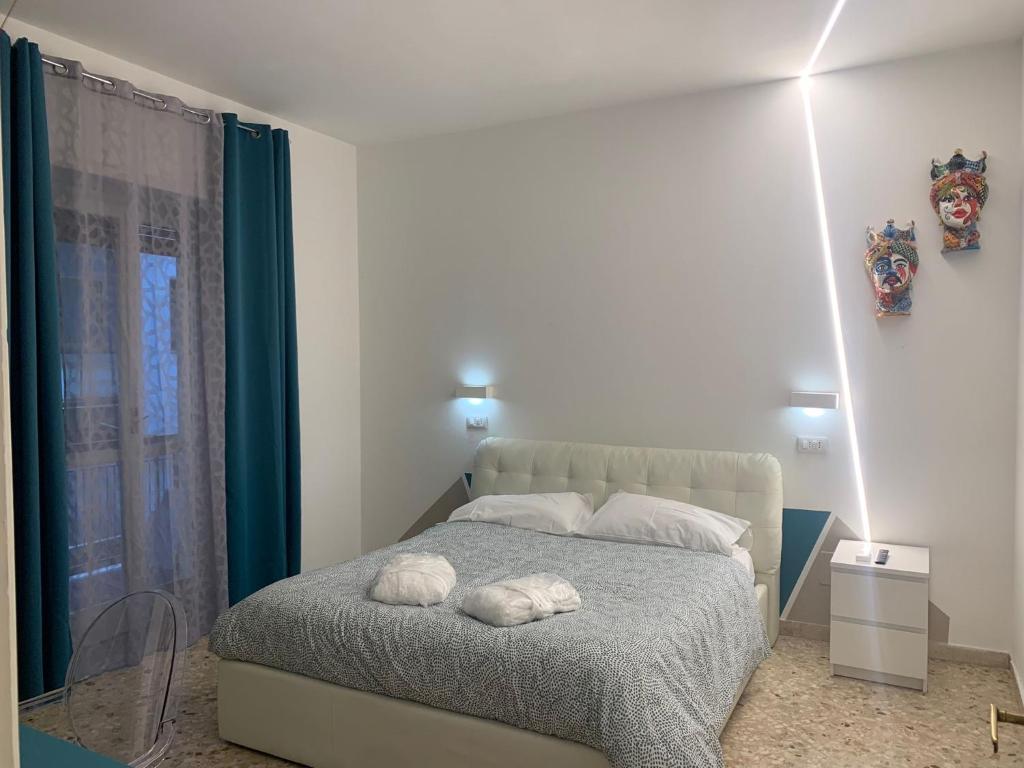 Posteľ alebo postele v izbe v ubytovaní Catania Apartment Borgo Suite Autonomous