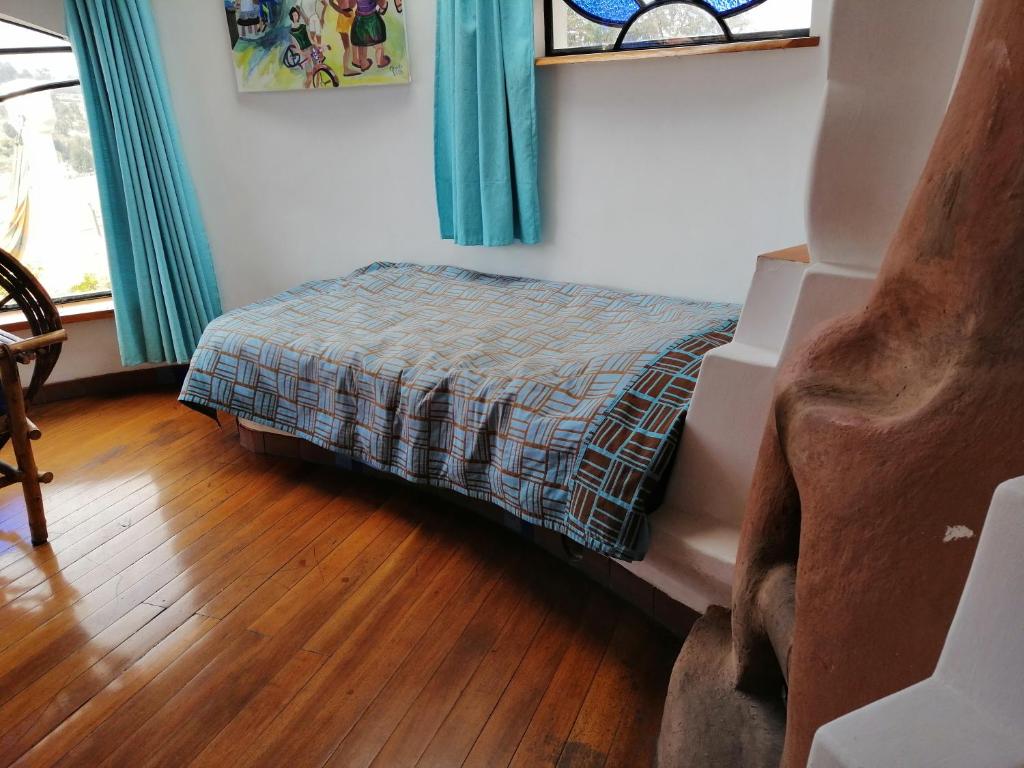 Postel nebo postele na pokoji v ubytování Hostal Las Olas