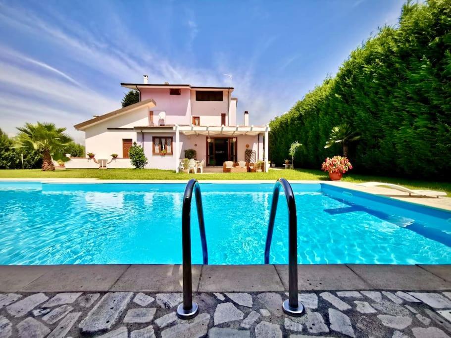 a villa with a swimming pool in front of a house at Casa Angelica (Pizzo, Tropea, Lamezia) in Maida