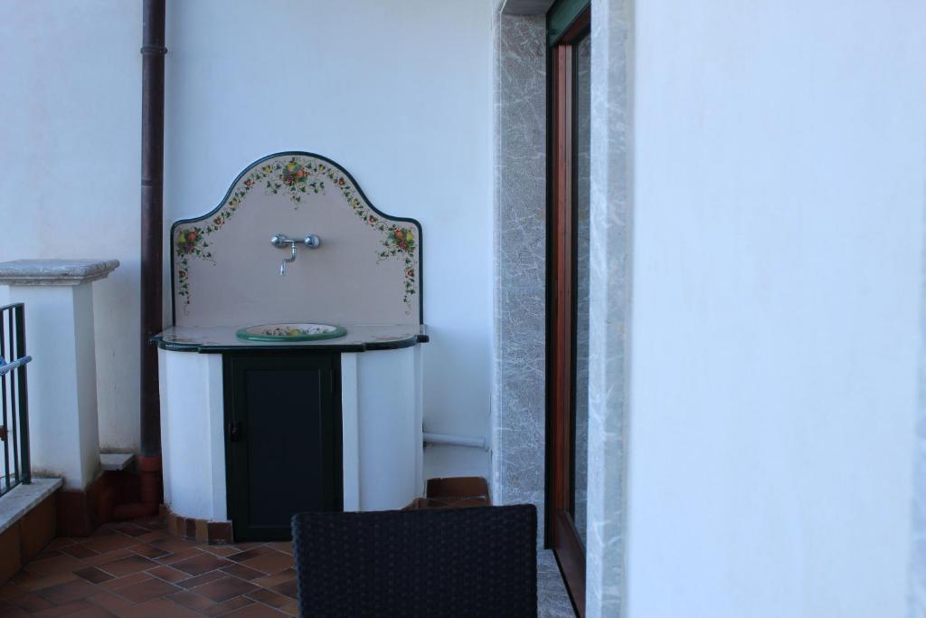 a bathroom with a sink in a room at Villa Sofia in Taormina