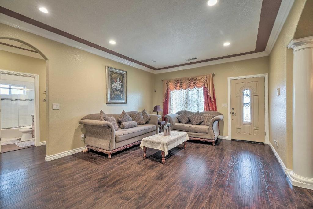 a living room with two couches and a table at Manteca Home with Gated Yard about 2 Mi to Downtown in Manteca