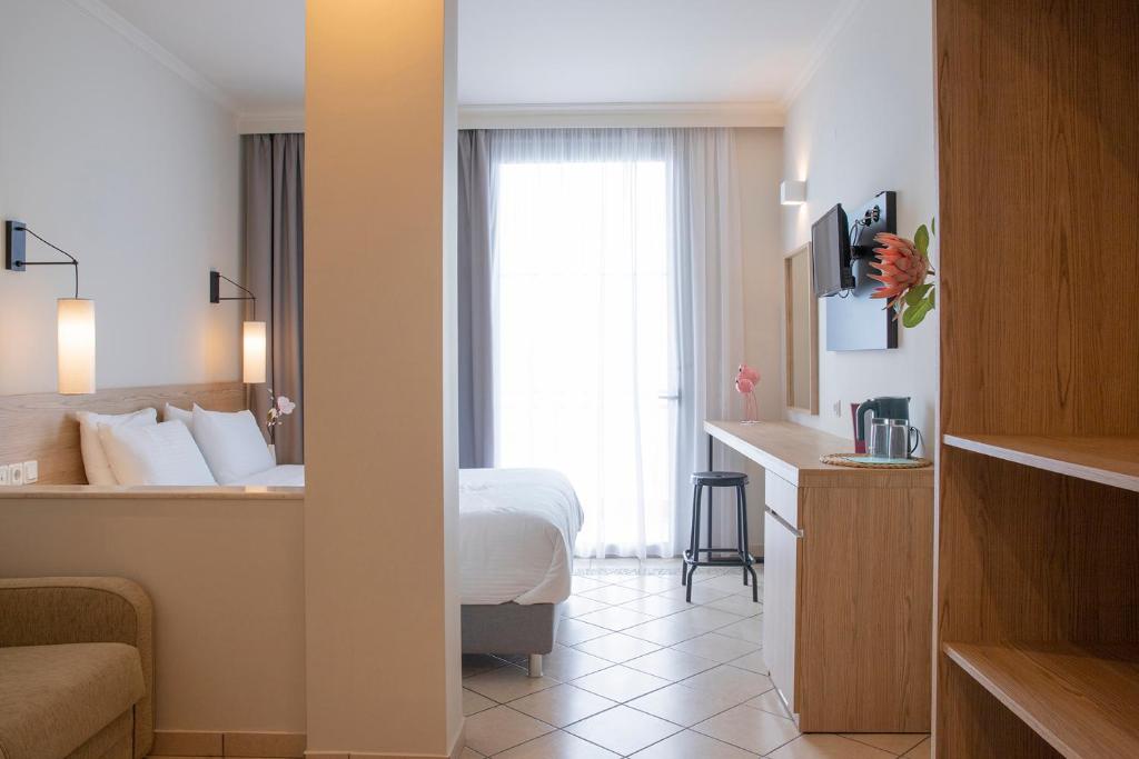 Postel nebo postele na pokoji v ubytování Zefyros Sea View Hotel
