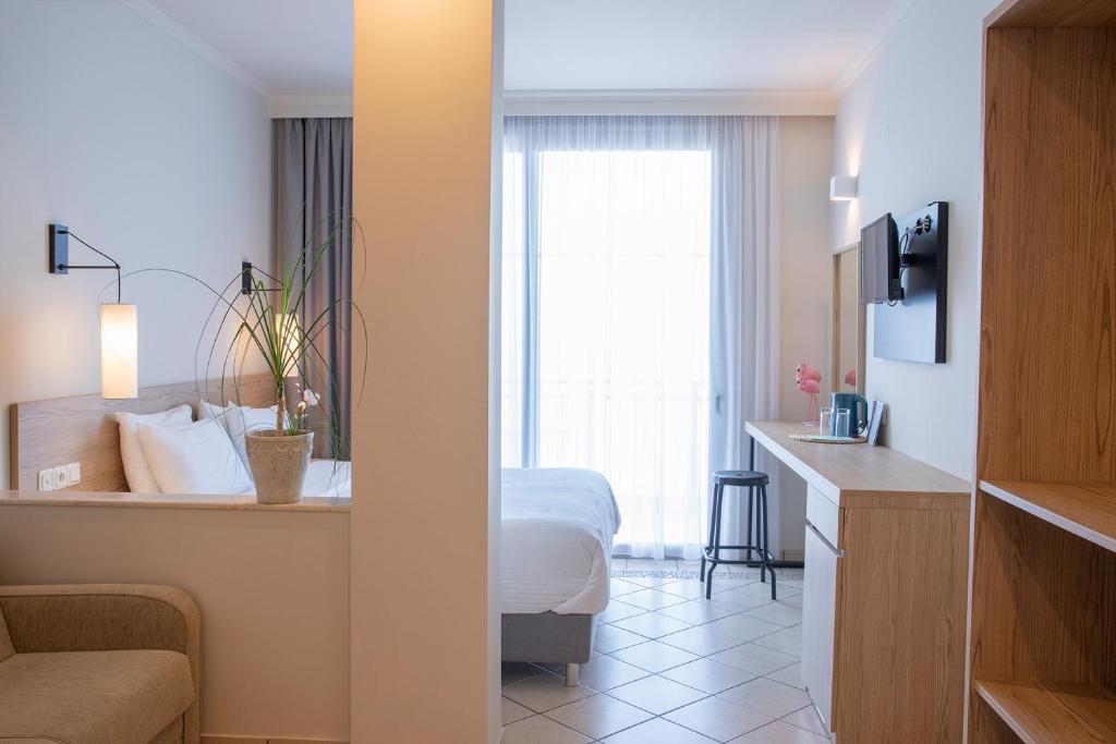 Postel nebo postele na pokoji v ubytování Zefyros Sea View Hotel