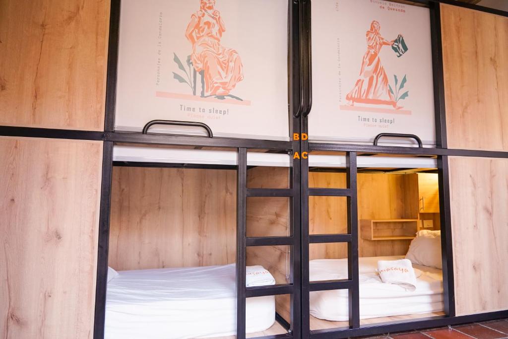 Postel nebo postele na pokoji v ubytování Masaya Bogotá
