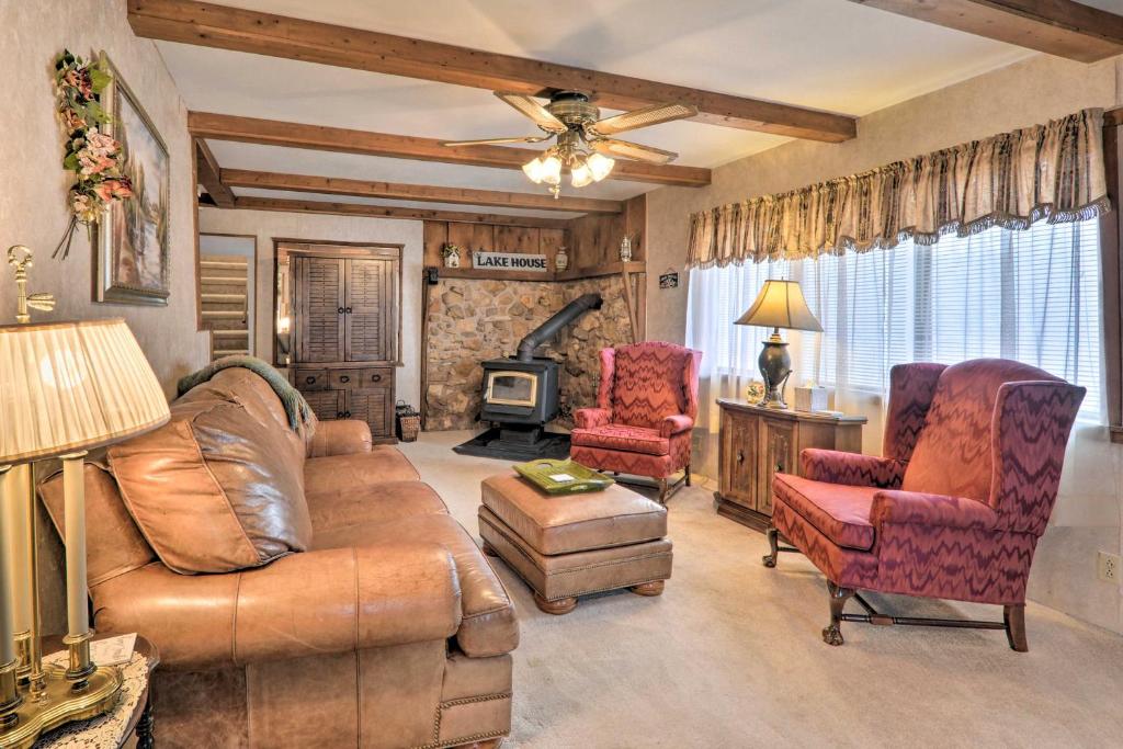 a living room with a couch and two chairs at The Lakehouse Lovely Wappapello Country Home! in Wappapello