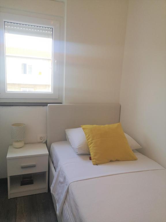 Postel nebo postele na pokoji v ubytování Apartments Tanja