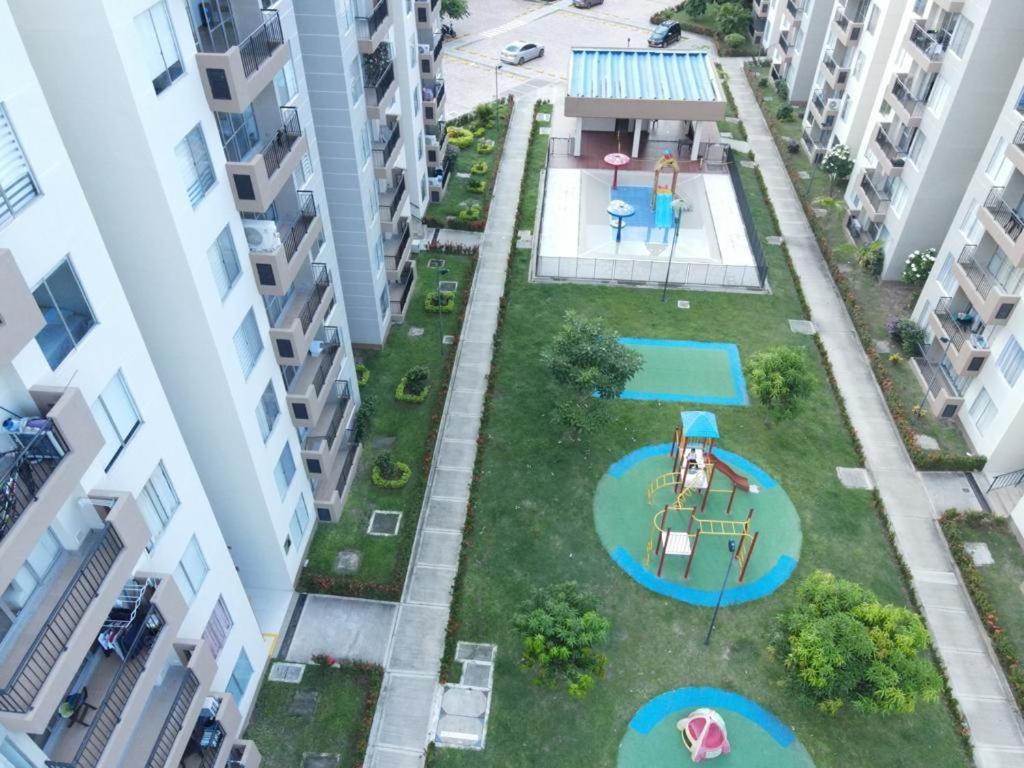 an aerial view of a courtyard between two buildings at Apartamento en Ricaurte in Ricaurte