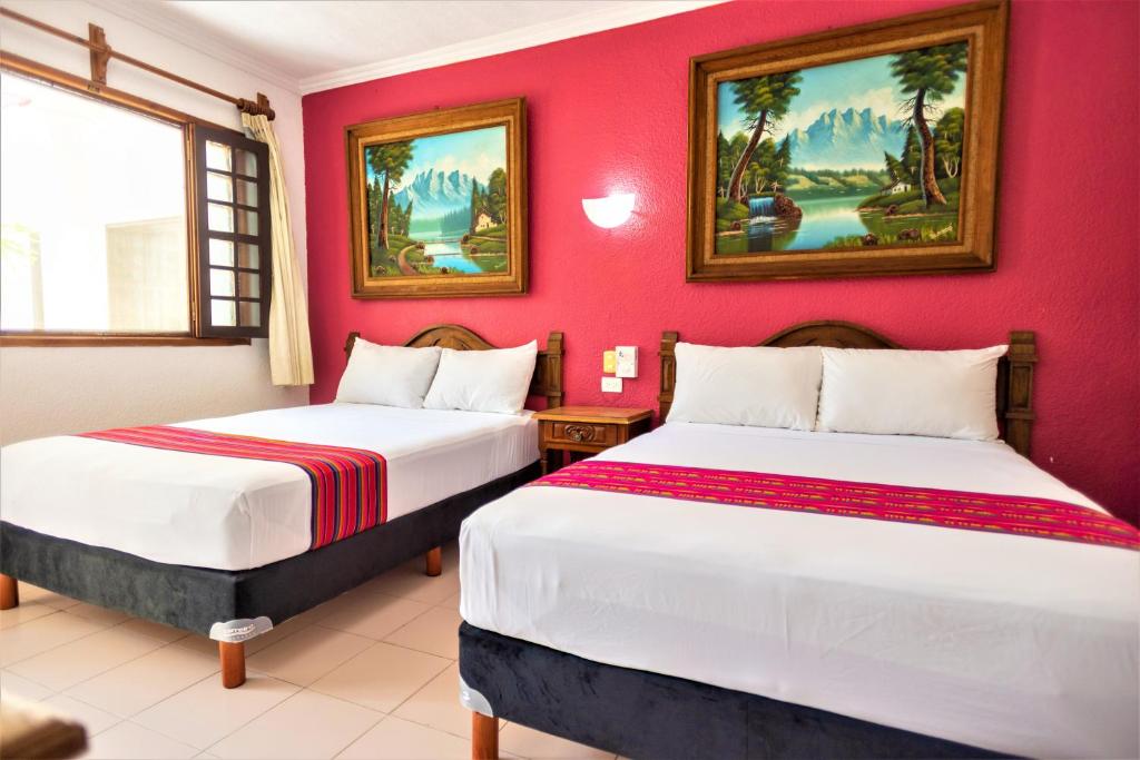Postel nebo postele na pokoji v ubytování Hotel San Juan Mérida