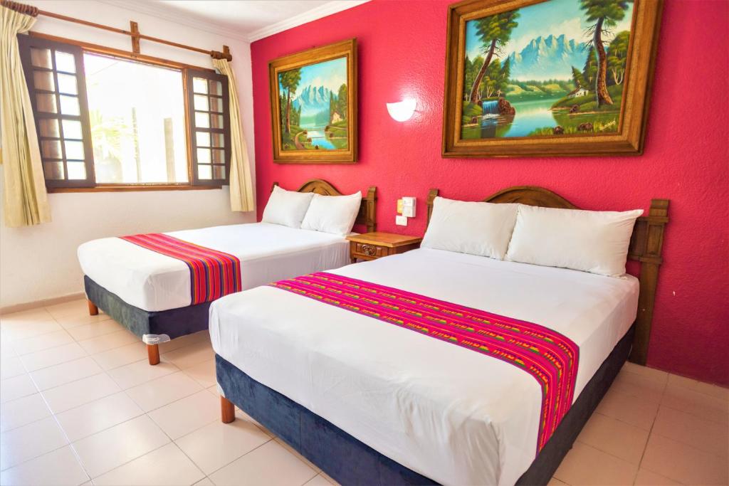 Postel nebo postele na pokoji v ubytování Hotel San Juan Mérida